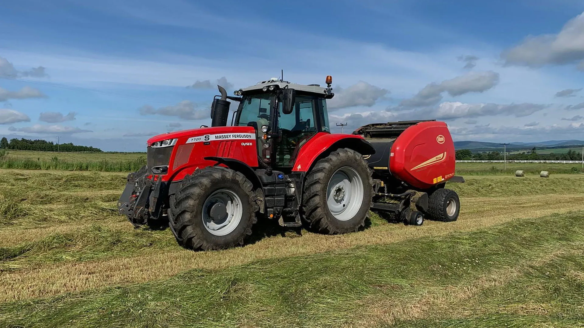 Red tractor and baler